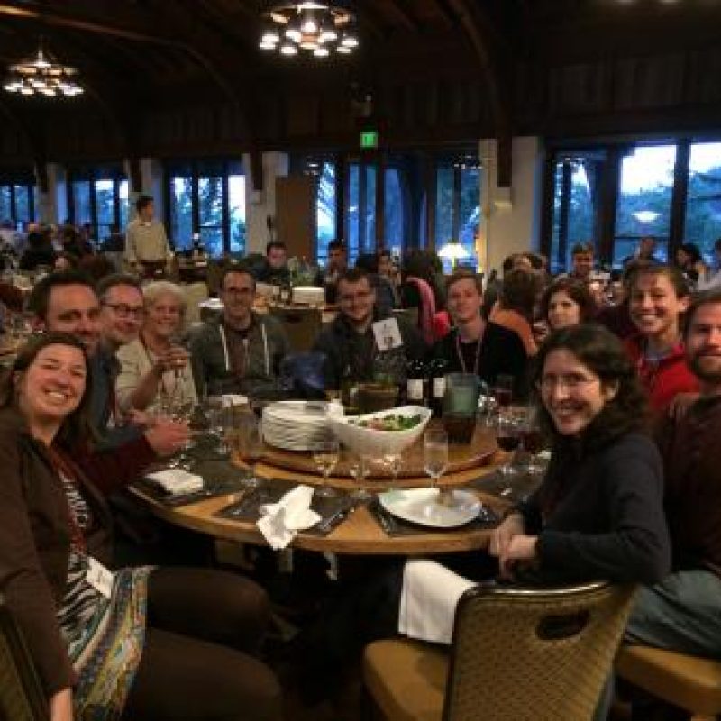 Glass Lab and Fleissner Lab gathered around a table in Asilomar