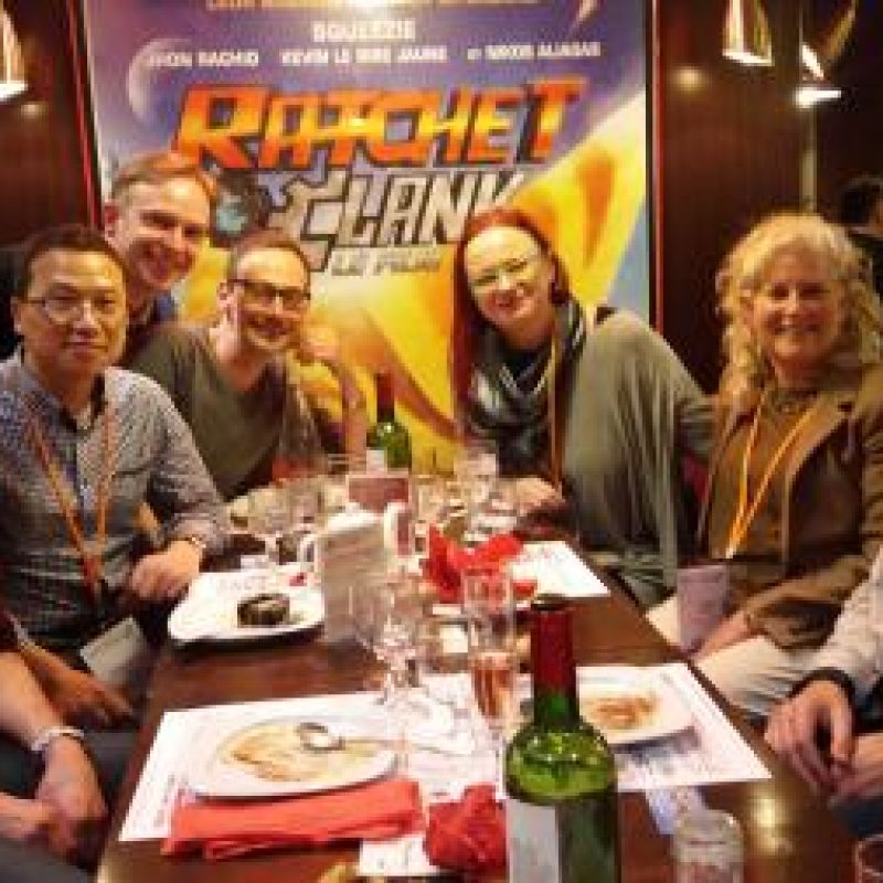 Different postdoc generations of the Glass Lab and some fungal friends group photo around a table