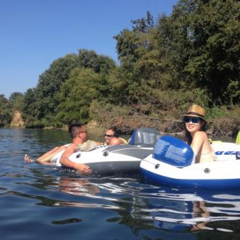 lab members tubing in the American River